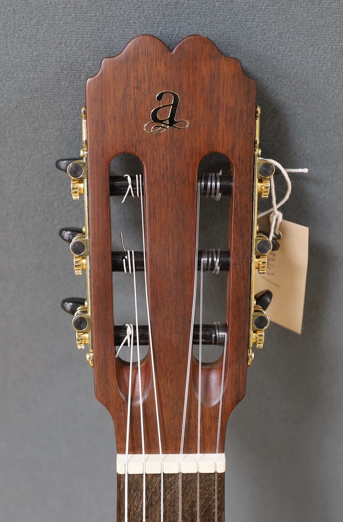 An Admira 'Concerto' classical guitar. Cedar top, satin finish with rosewood back and sides